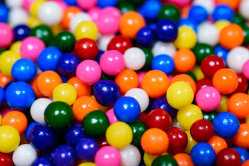 Fototapeta na wymiar Close up of brightly colored rainbow candy sprinkles