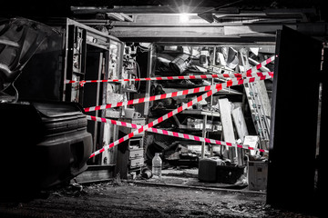 fenced garage at the crime scene, background blurred with bokeh effect