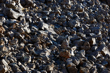 A pile of black stones of volcanic origin. North Caucasus.