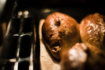 Baked pies on a tray in the oven