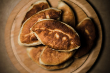 Pies on a wooden round board