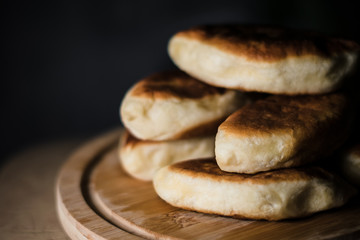 Pies on a wooden round board