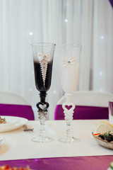 Beautiful wedding glasses for the newlyweds. Champagne glasses. glasses of the bride and groom for the wedding