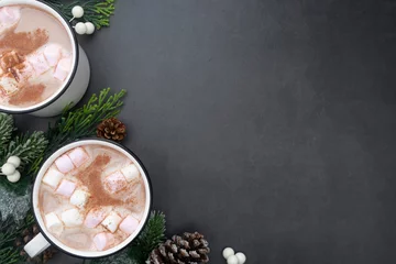 Foto op Canvas Hot chocolate mugs with marshmallows. Flat lay with fir branches. Gray background. Warm winter drink. © Inga
