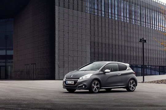 Katowice, Poland - 05.05.2016:Peugeot 208 GTI stands in front of a building Convention Center.