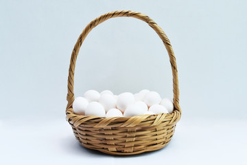 Fototapeta na wymiar Many eggs in basket isolated