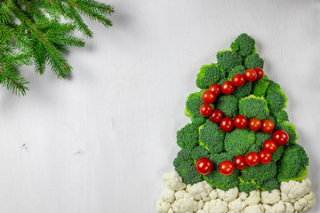 Edible Christmas tree shaped vegetable isolated on white background for holiday seasonal festive party celebration with healthy food decoration. Cooking step by step