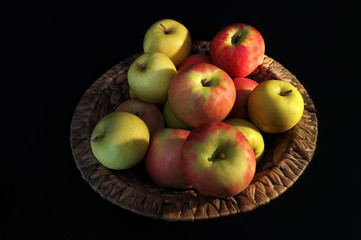 Green and red apples in the basket