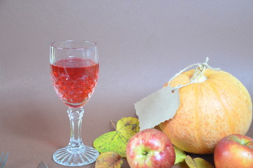 Thanksgiving Day. Pumpkin, pumpkin with autumn leaves and apples. Autumn harvest on a brown...