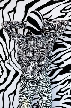 Anonymous model in headscarf near zebra wall