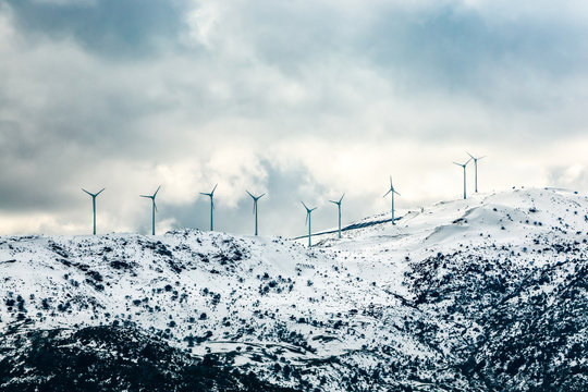 Wind Turbines on a Snowy Mountain