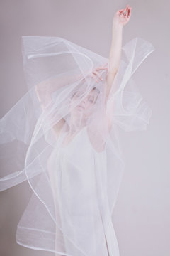Attractive woman with eyes closed in veil