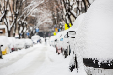 snow-covered street and cars
