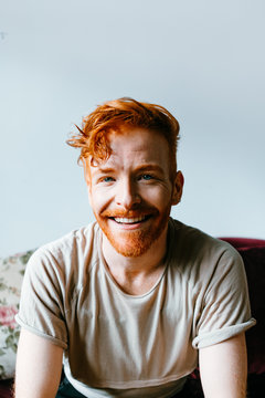 portraits of young redhead cool man