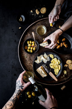 Overhead view of man and woman eating Spanish tapas