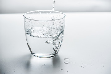 glass with water on a white background