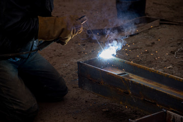 Welding work at a construction site. The construction of a metal frame.