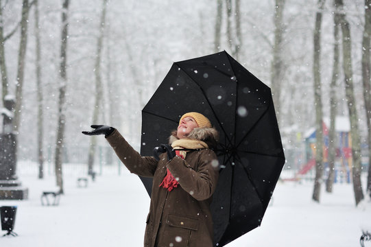 The woman in a snowy park