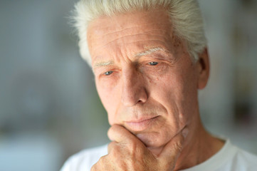 Close up portrait of thoughtful senior man