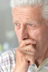 Close up portrait of thoughtful senior man