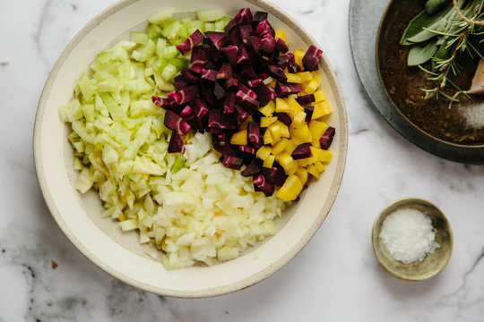 Preparation of a sofrito for a slow cooked dish.