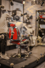 shaving brushes rain from the sky while the barber is at work - bnw photo