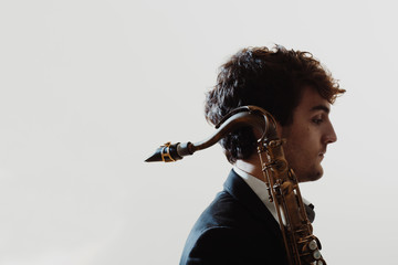 Portrait of young man with saxophone