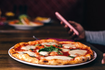 Pizza with mozzarella and black background