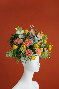 Flowers inside a mannequin?s head.