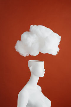 Big white cloud over a mannequin?s open head.