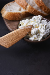 cottage cheese with wooden knife