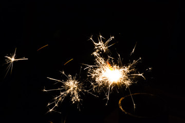 festive sparkler fireworks on black background