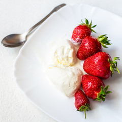 Ripe fresh strawberries and ice cream