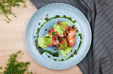 Steak with green sauce and pumpkin