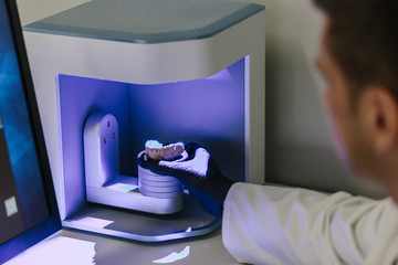 Orthodontists working in profesional dental lab