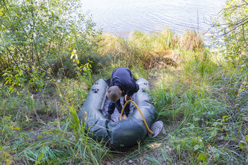 A child is preparing an inflatable boat