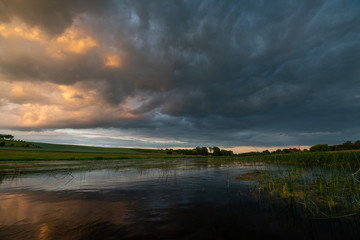 Naklejka premium river and sunset