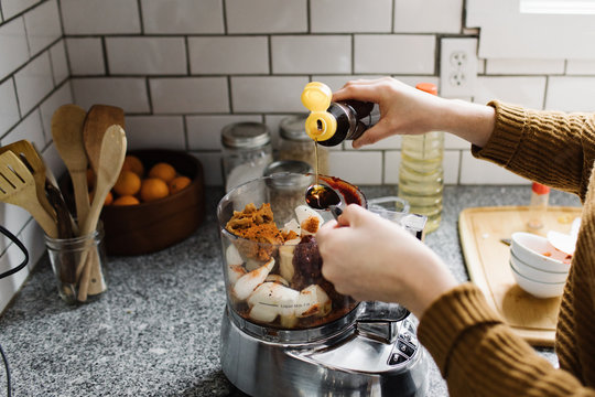 Woman Mixing Ingredients in a Food Processor - Powered by Adobe