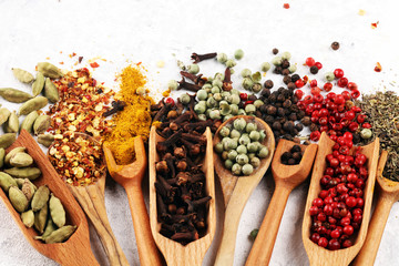 Spices with pepper on table. Food and cuisine ingredients for cooking on rustic background