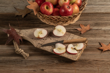 sliced apples on a wooden cutting board on a table
