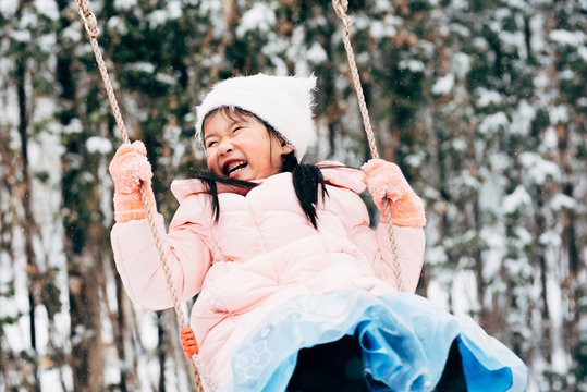 Cute girl playing in snow