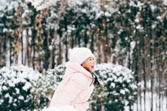 Cute girl playing in snow