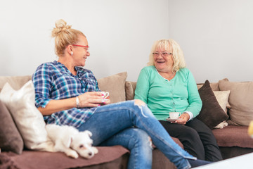 Mother and daughter drinking a morning coffee