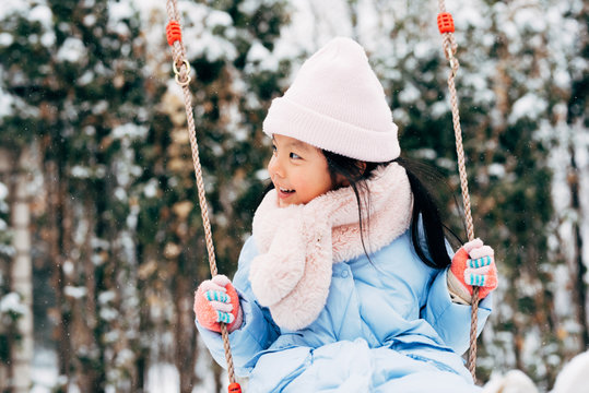 Cute girl playing in snow