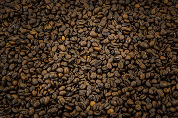 Roasted coffee beans background, close- up 