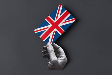 Hand with a union Jack Flag