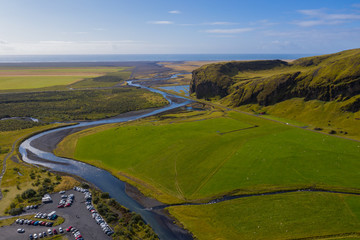 Beautiful lush green Landscape of Skoga river valley cascades near Skogafoss waterfall and Skogar end of Fimmvorduhals hiking trail. South Iceland, aerial drone view, september 2019