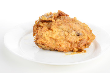 Fried Chicken Thigh on White Plate against White BG with copy space