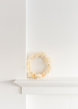 Minimal Scandinavian decor on mantle a living room