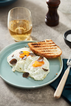Served fried eggs with truffle seasoning